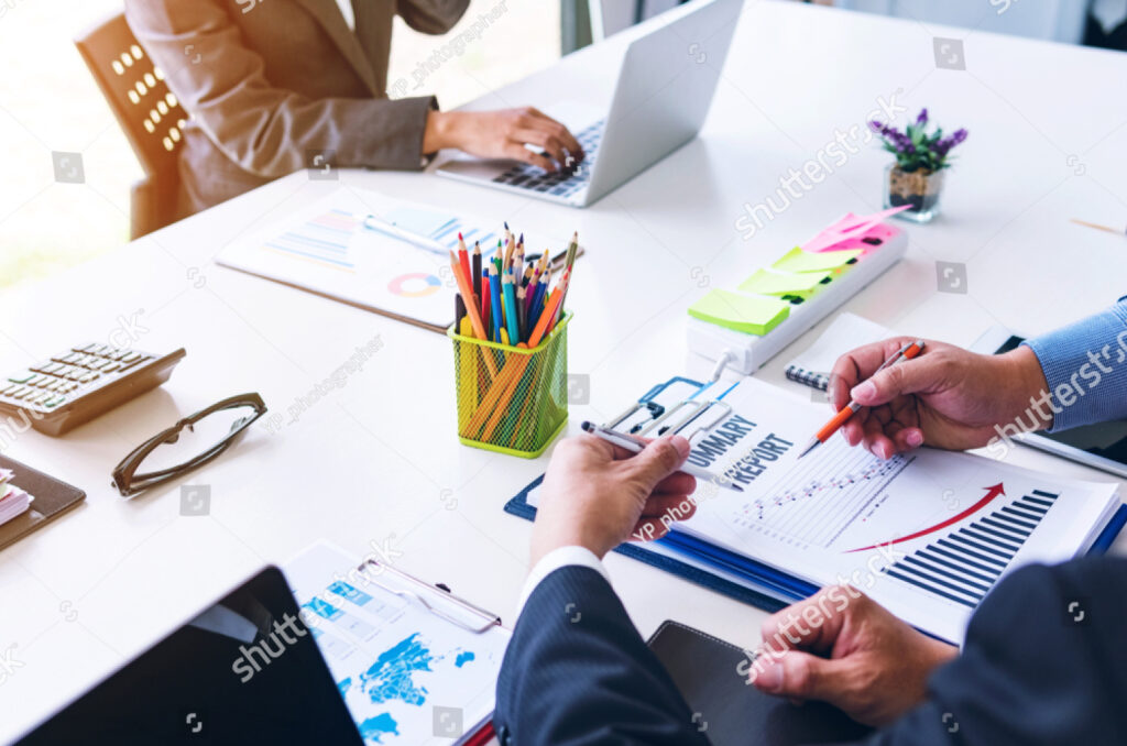 stock-photo-business-people-meeting-group-working-with-summary-report-document-in-conference-room-1119517070 (1)